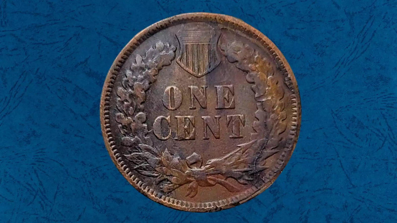 1906 Indian Head penny major die crack error showing raised line running across Liberty's headband toward the rim